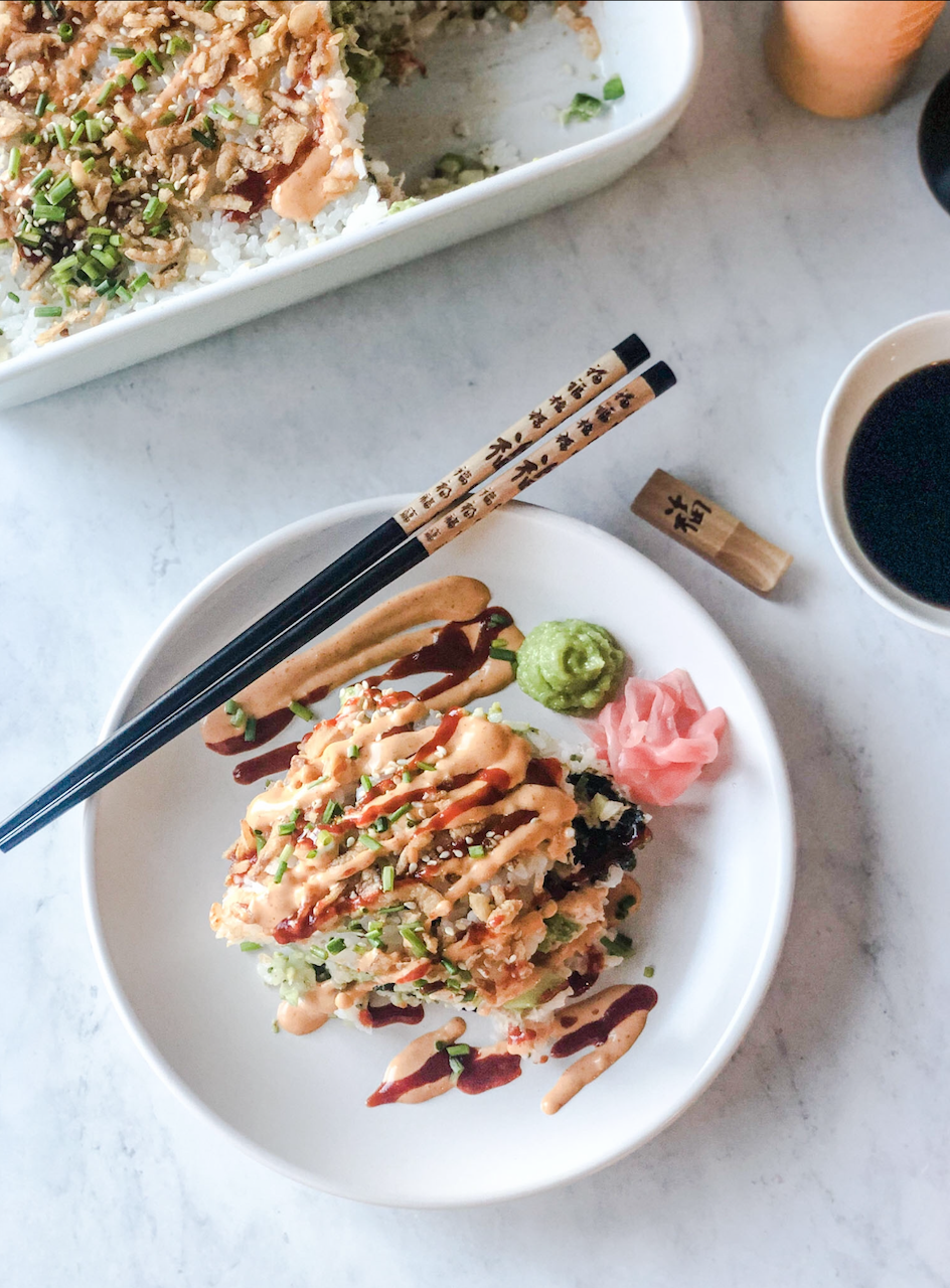how to make crab sushi bake plated crab sushi bake with chopsticks on the side, and soy sauce and the casserole dish in the background