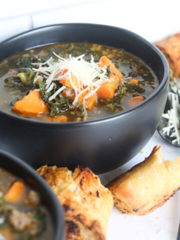 Kale and potato soup topped with shredded parmesan cheese.