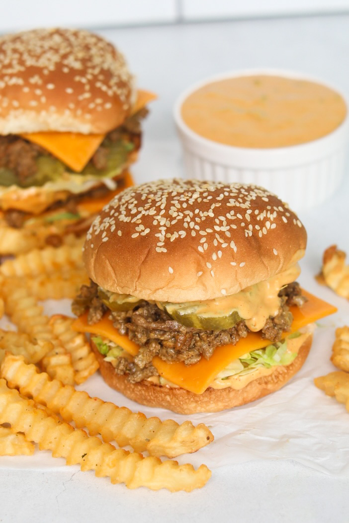 Big Mac Sloppy Joe image with stacked burger with ground beef "sloppy joe" texture. Fries are added for styling purposes.