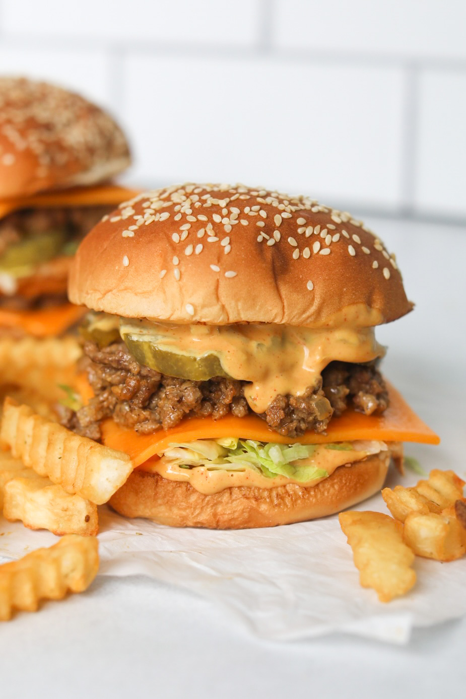 Big Mac Sloppy Joe image with stacked burger with ground beef "sloppy joe" texture. Fries are added for styling purposes.