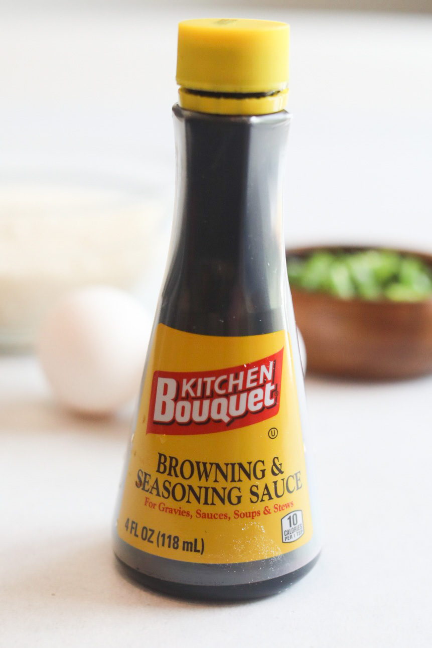 Recipe ingredient: Browning and Seasoning Sauce Bottle. Brown bottle with yellow labeling and top with seasoning label written in red and white reading, "Kitchen Bouquet".