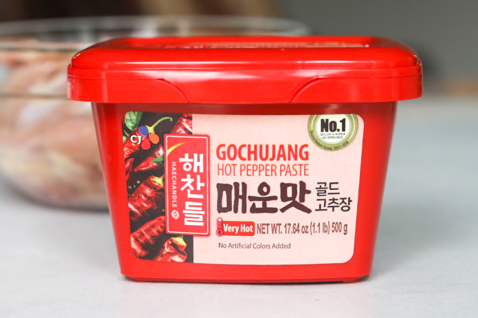 Spicy Chicken Teriyaki Ingredient. Gochujang image in a red tub with hot red pepper paste inside.