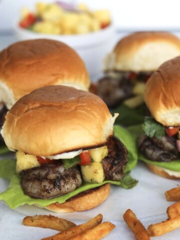 Jerk shrimp sliders with fries.