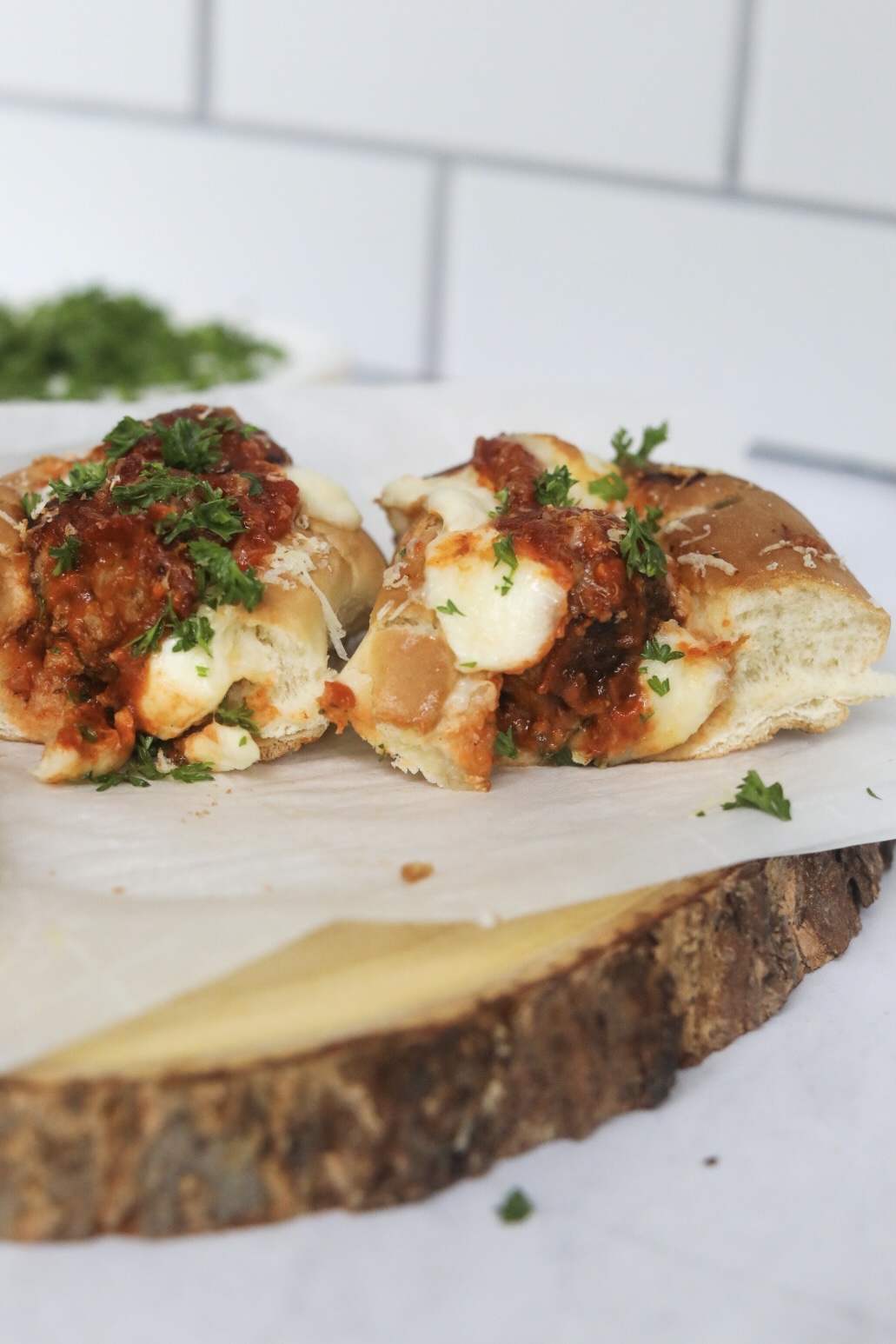 a meatball sandwich sliced in half