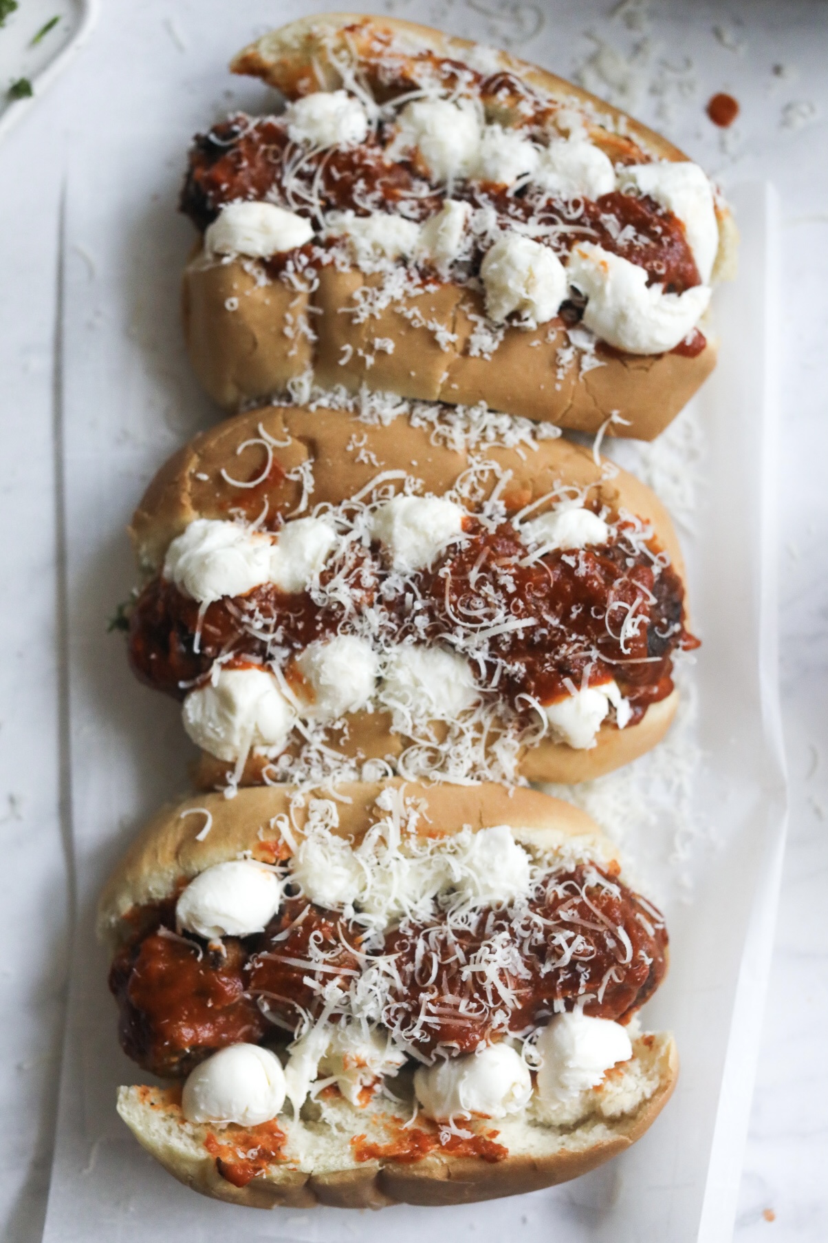 assembled meatball grinders prior to baking