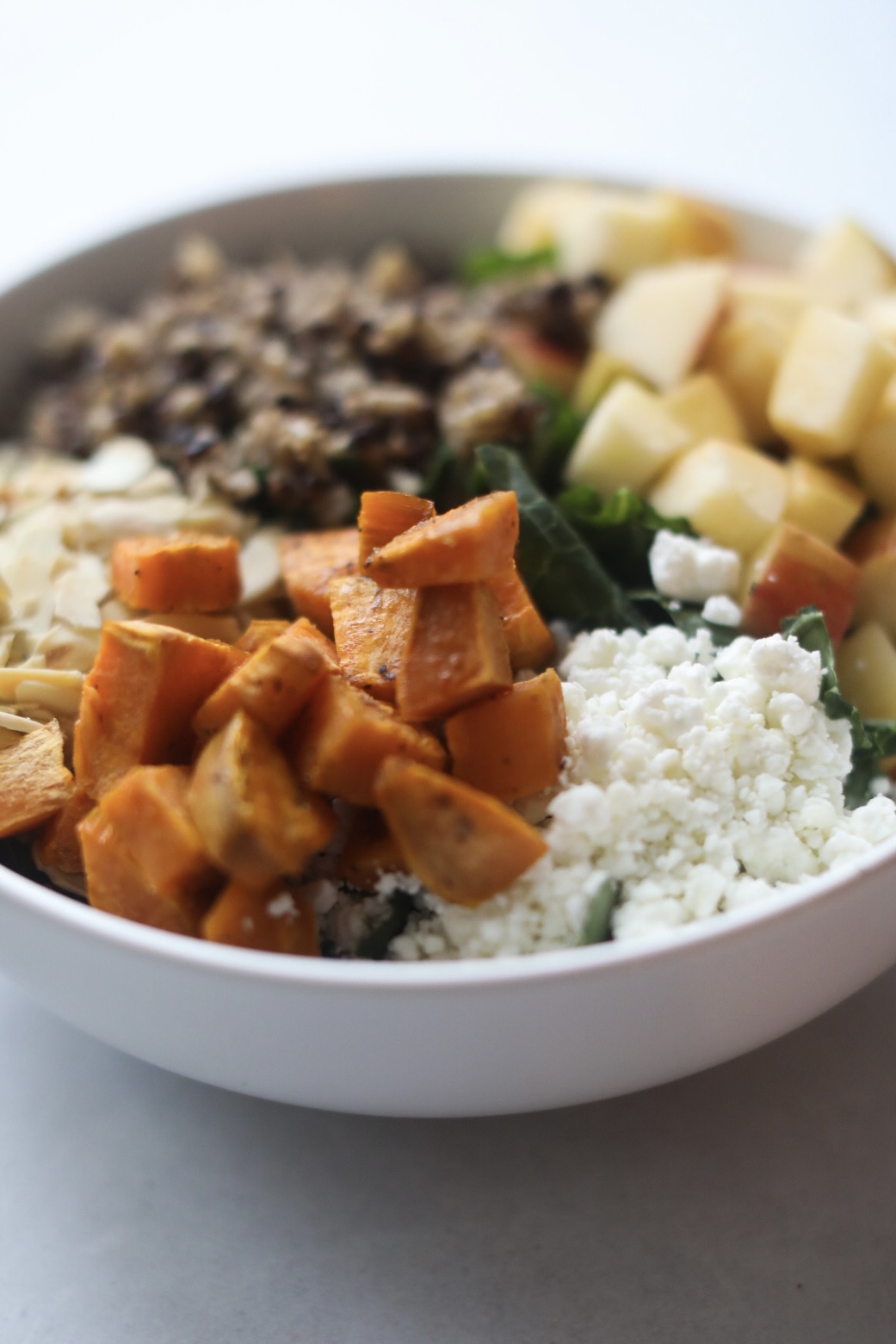close up view of harvest bowl with a focus on sweet potatoes