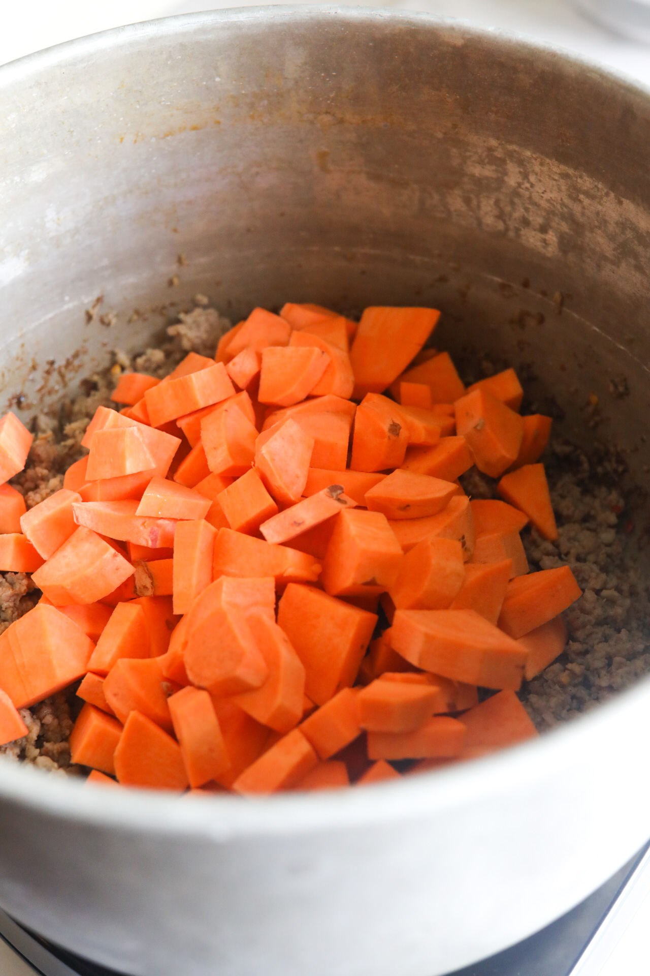 diced sweet potatoes added to the pot