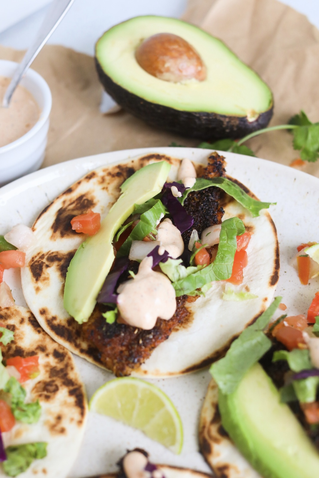 Tacos with creamy remoulade sauce and blackened fish.