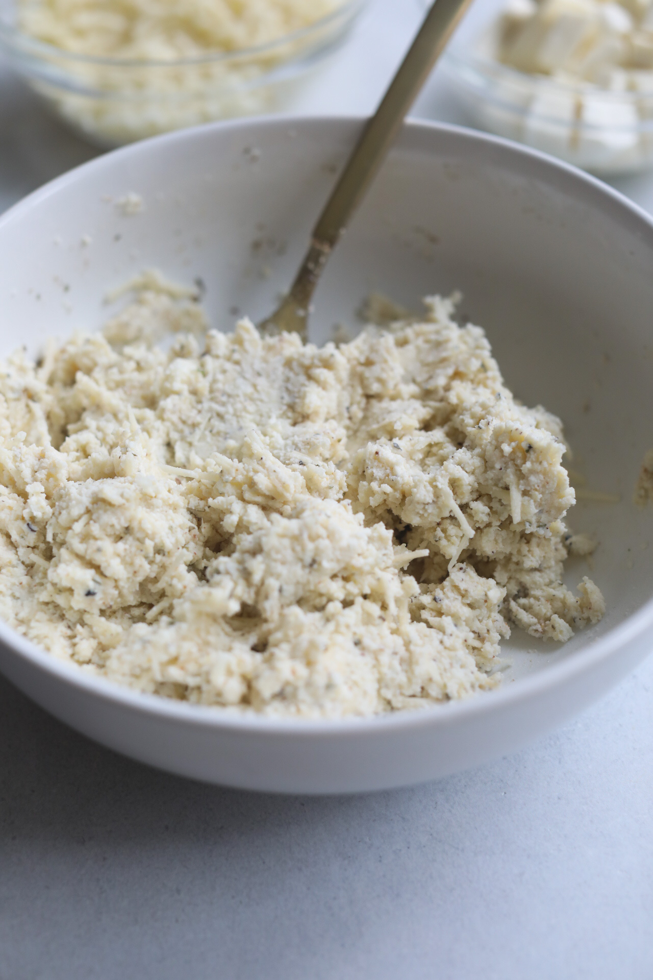 ricotta mixture for one pot lasagna Ricotta mixture in a white bowl mixed with ingredients.