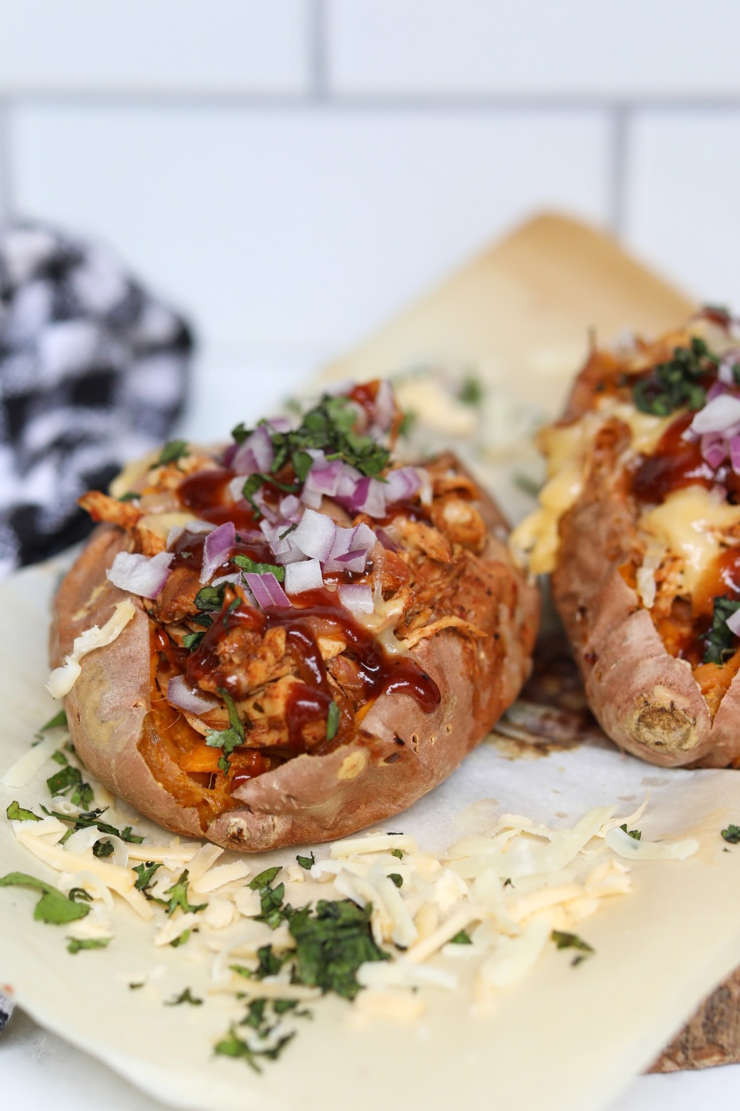 two BBQ chicken loaded sweet potatoes