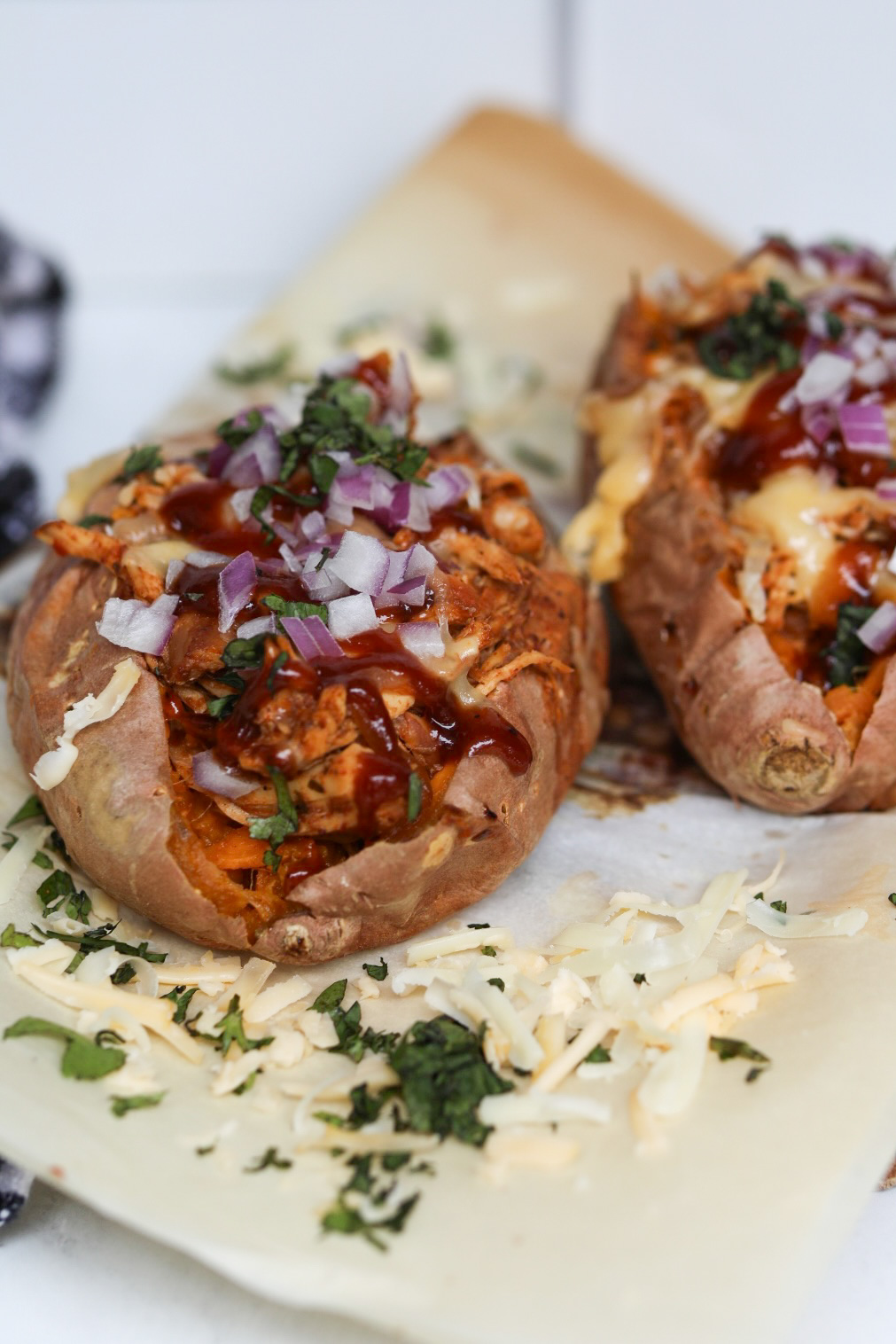 two BBQ chicken loaded sweet potatoes