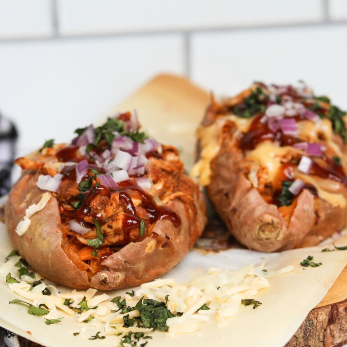 two BBQ chicken loaded sweet potatoes