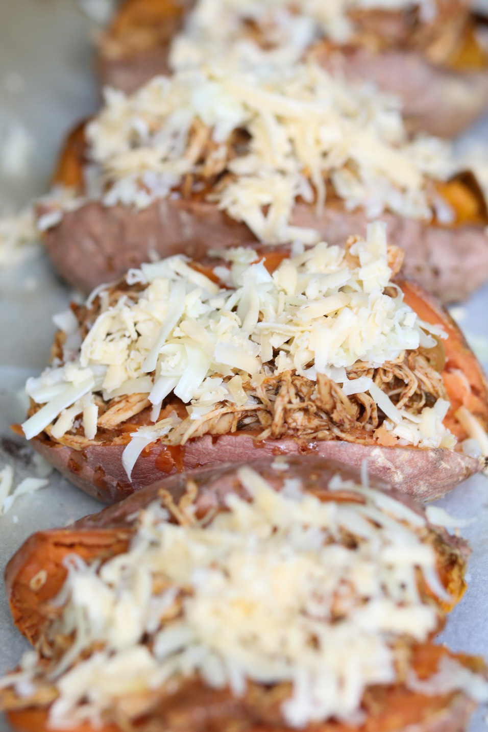 shredded cheese added to stuffed sweet potatoes