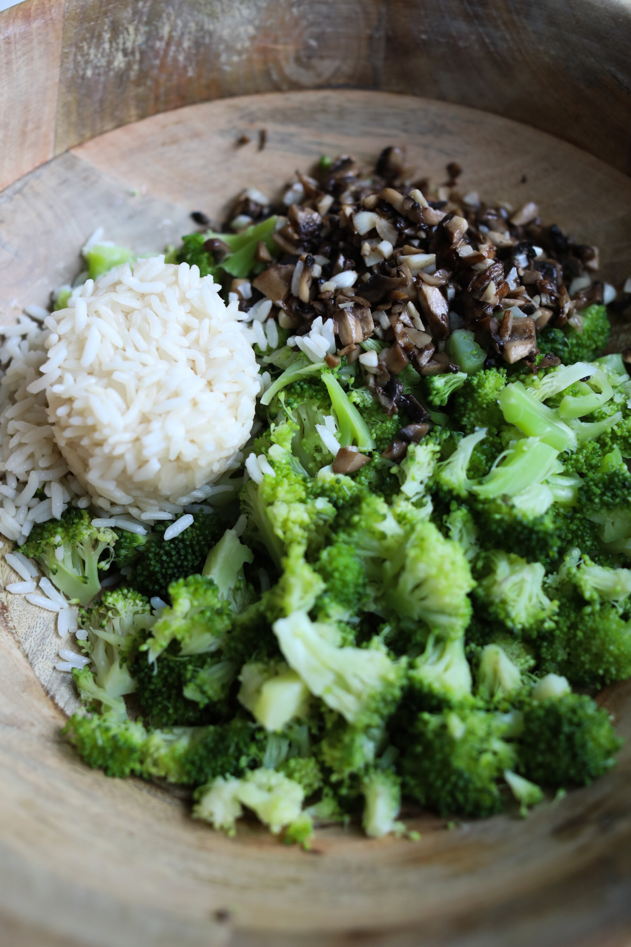 Broccoli Mushroom and Rice in wooden bowl.