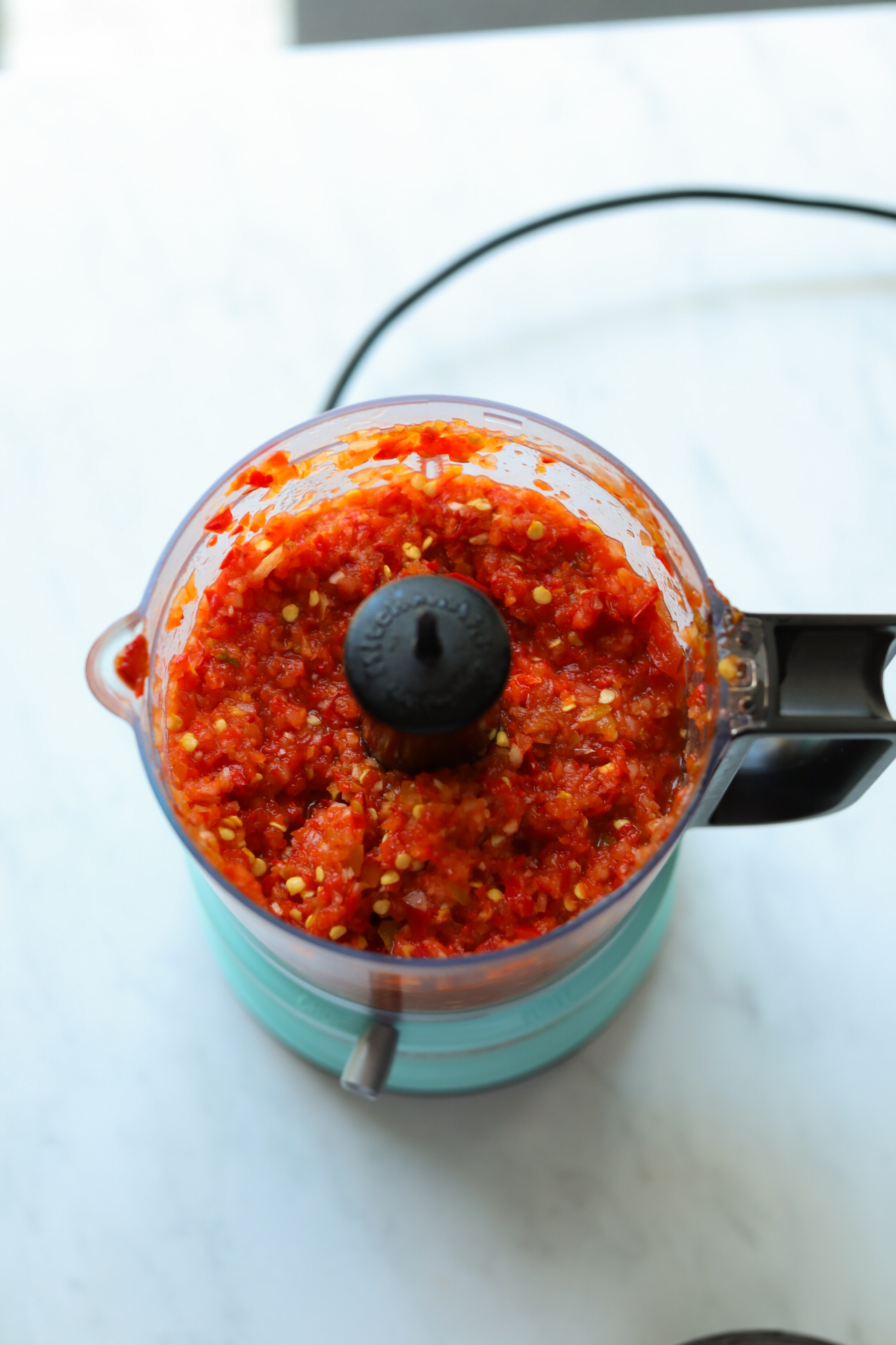 blended saucer full of cherry pepper relish in food processor