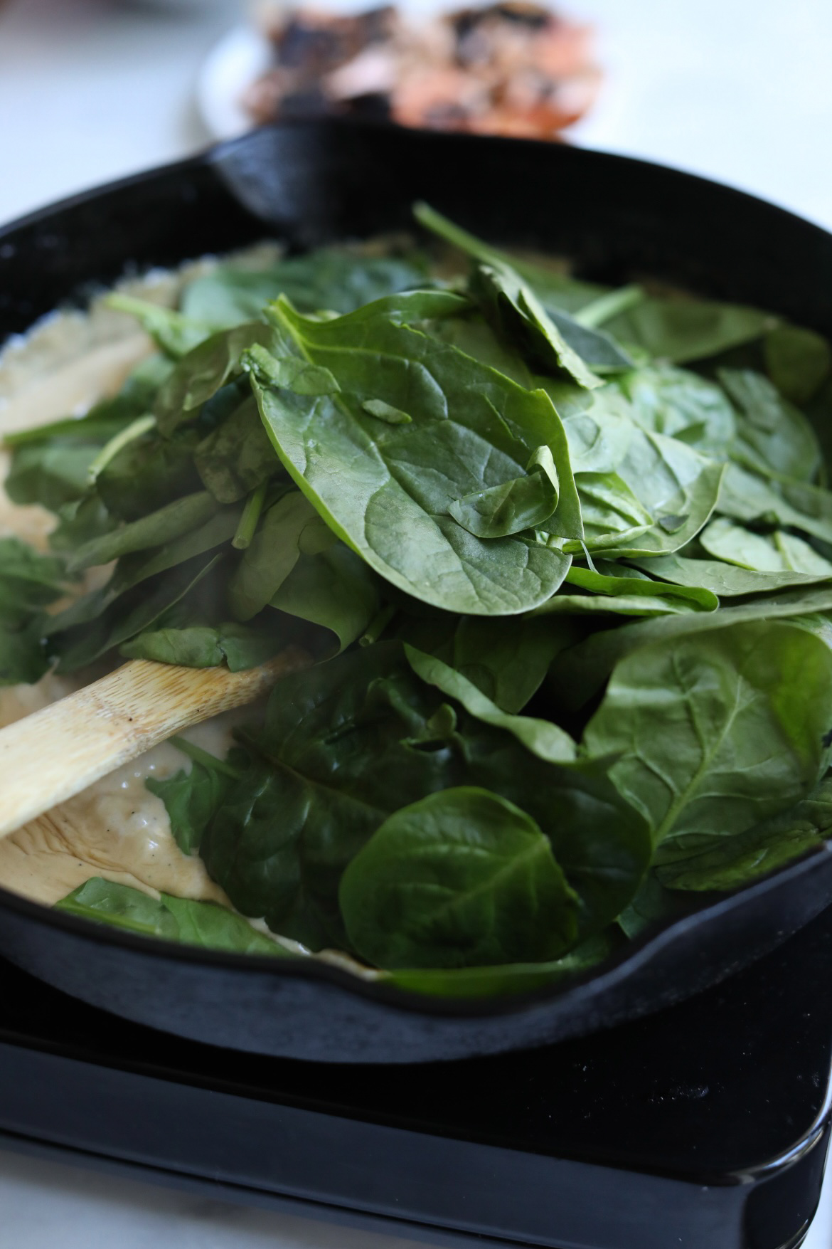 healthy salmon pasta spinach added to cream sauce