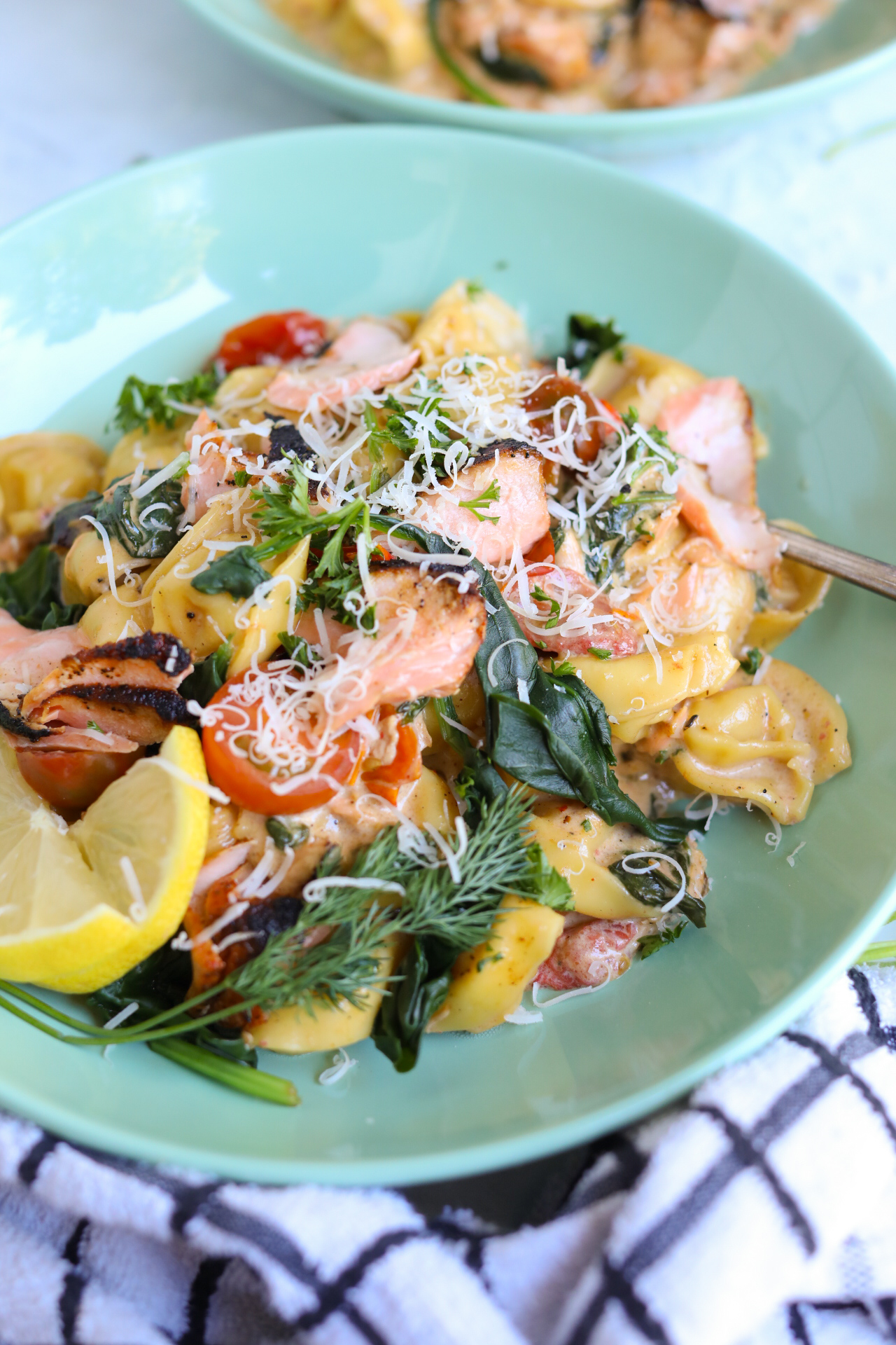 salmon pasta with spinach plated salmon pasta