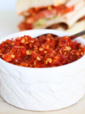 a saucer full of cherry pepper relish