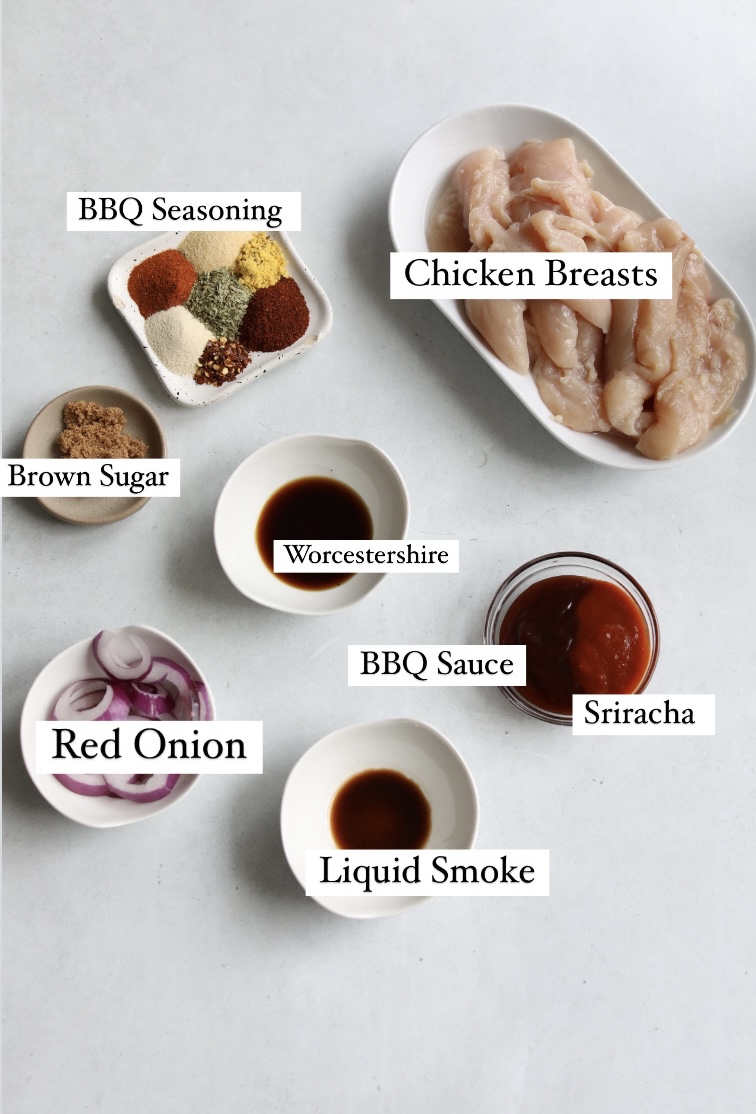Slow cooker BBQ chicken ingredients in a flat lay with text labels.