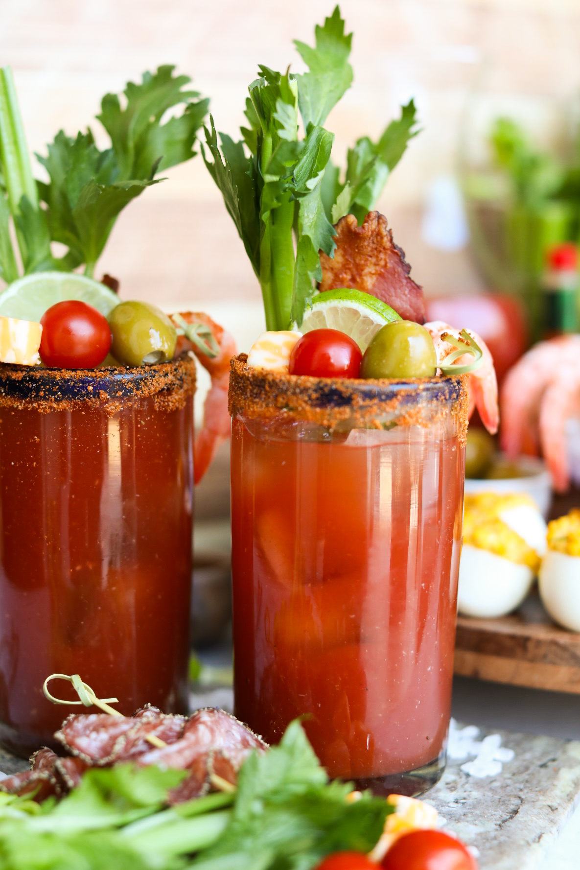 close up view of two glasses of bloody mary