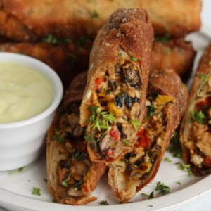 Featured image for southwestern egg rolls, zoomed in showing contents of the filling.