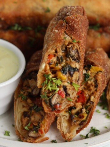 Featured image for southwestern egg rolls, zoomed in showing contents of the filling.