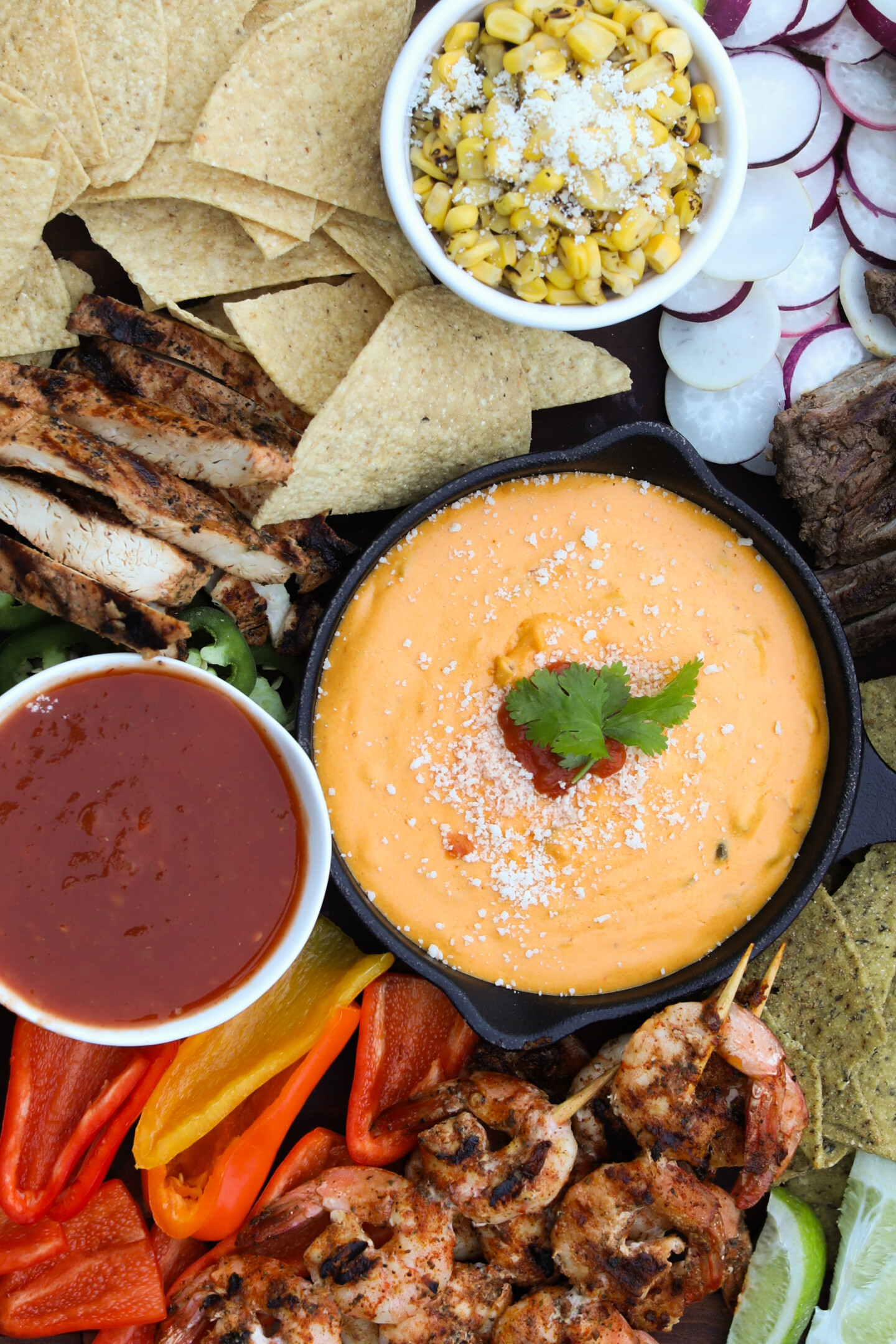 Mexican themed charcuterie board Top down view of nacho board.