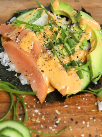 Featured image of smoked salmon tacos with spicy mayo drizzle. ETBT seasoning added and extra sliced green onion added for styling purposes.
